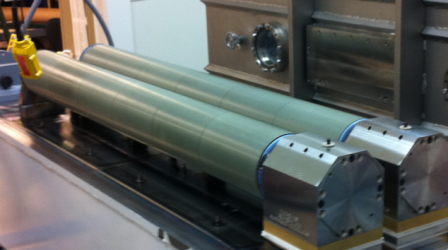 Industrial-scale dual magnetron system for large-area glass coating